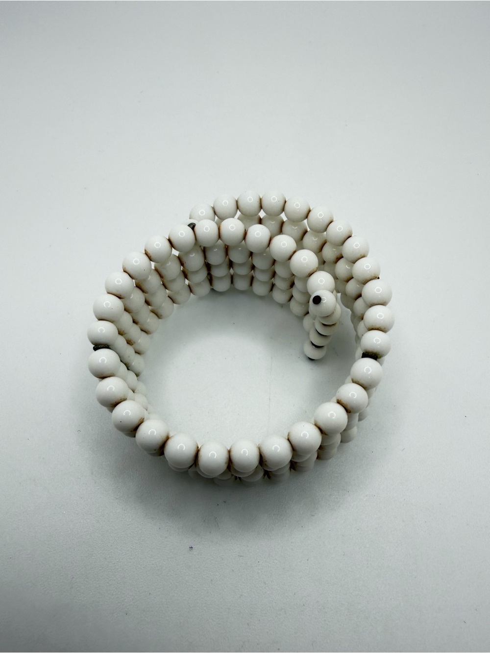 ~7.5" Antique 4 rows of milk glass bracelet on memory wire!